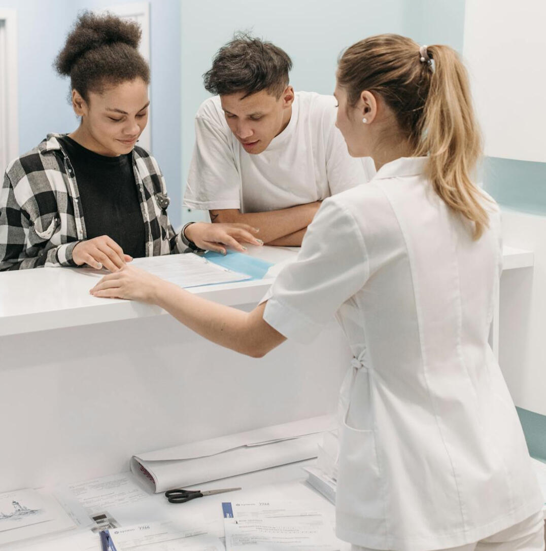 patients at a healthcare front desk